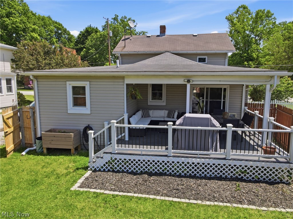 3490 County Line Road Madison, OH 44057 - Photo 3 of 42 Covered outdoor deck with white railing system and dark flooring