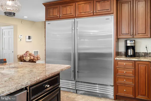 a kitchen with lots of counter top space and stainless steel appliances