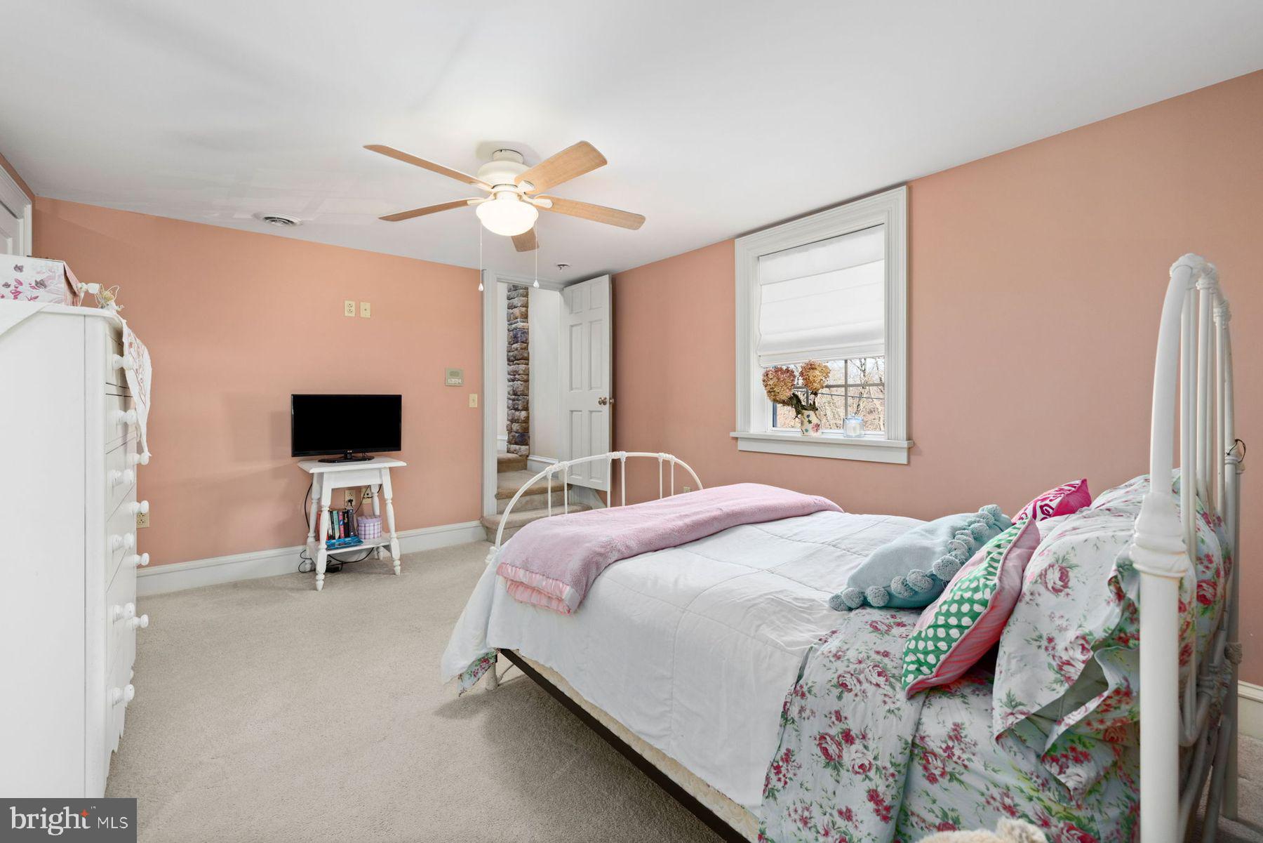 688 Sylvan Dell Road Williamsport, PA 17702 - Photo 35 of 73 a bedroom with a bed and a chandelier