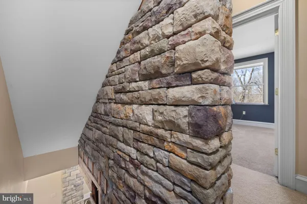 a living room with fireplace furniture and a wooden floor