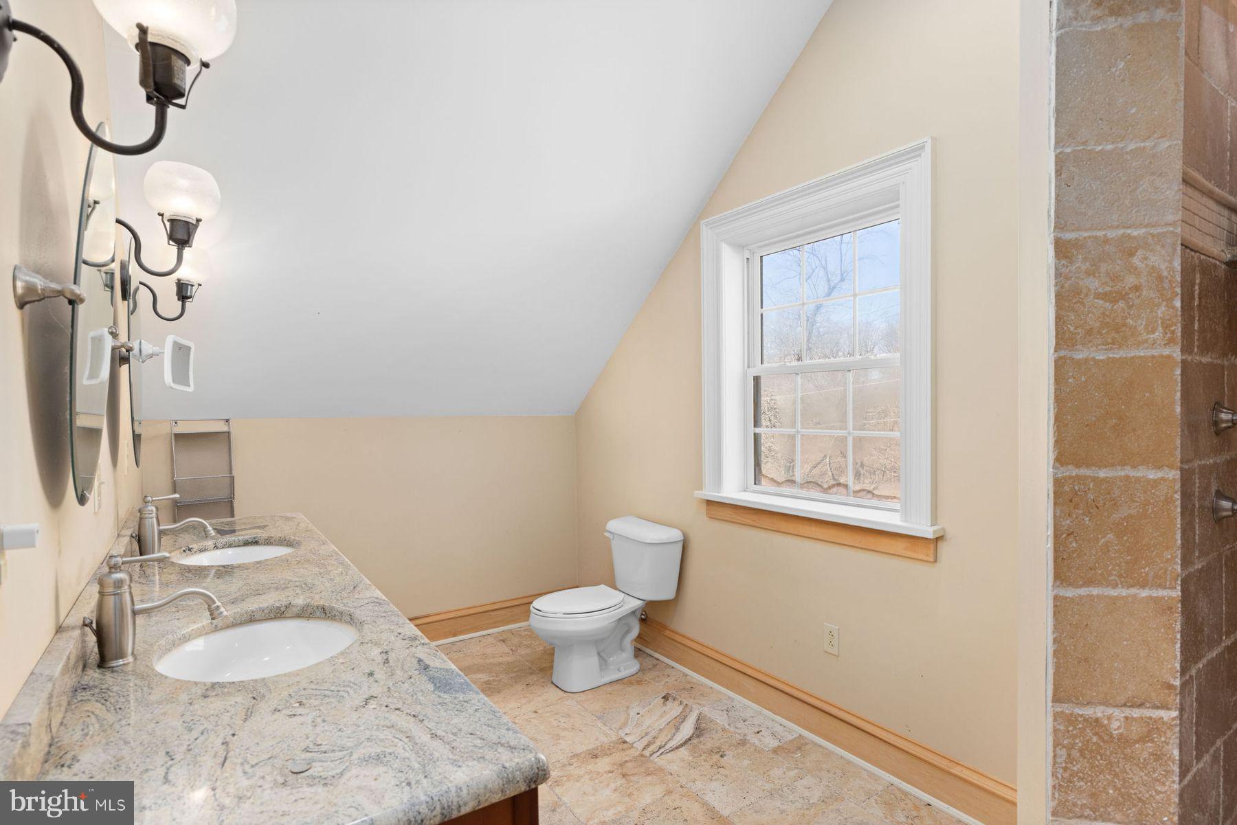 688 Sylvan Dell Road Williamsport, PA 17702 - Photo 49 of 73 a bathroom with a granite countertop toilet sink and mirror