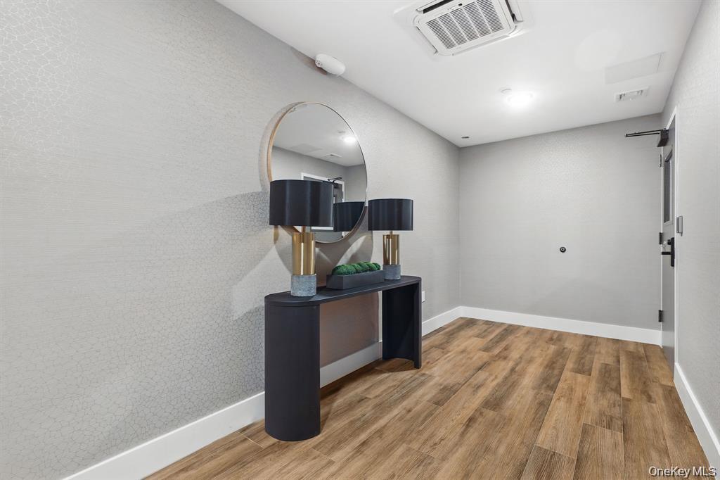 199 East Post Road, Unit 203 White Plains, NY 10601 - Photo 8 of 13 a view of entryway with wooden floor