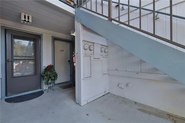 a view of a hallway with entryway and front door
