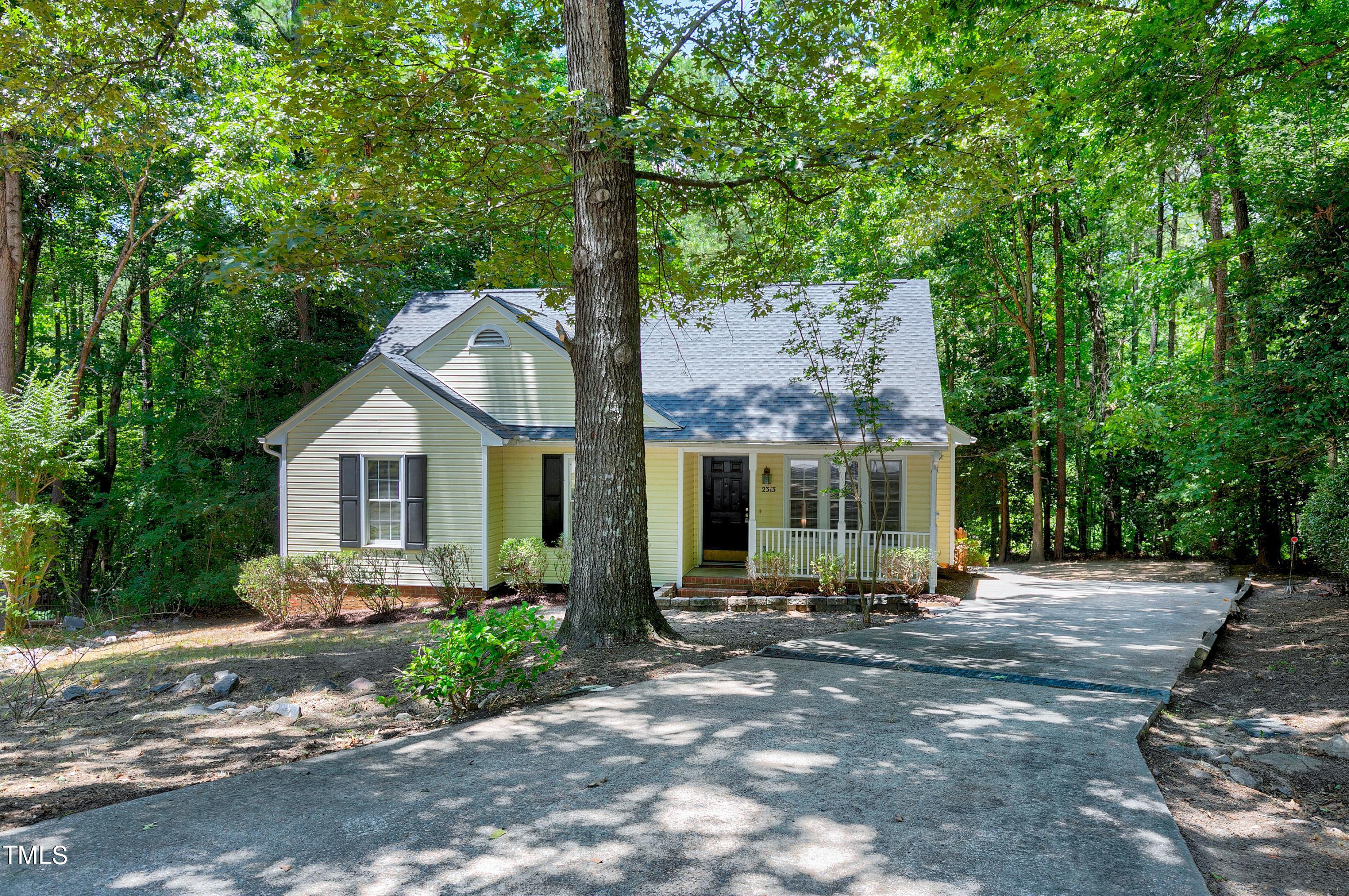 2313 Ruddy Road Raleigh, NC 27616 - Photo 1 of 32 a front view of a house with garden