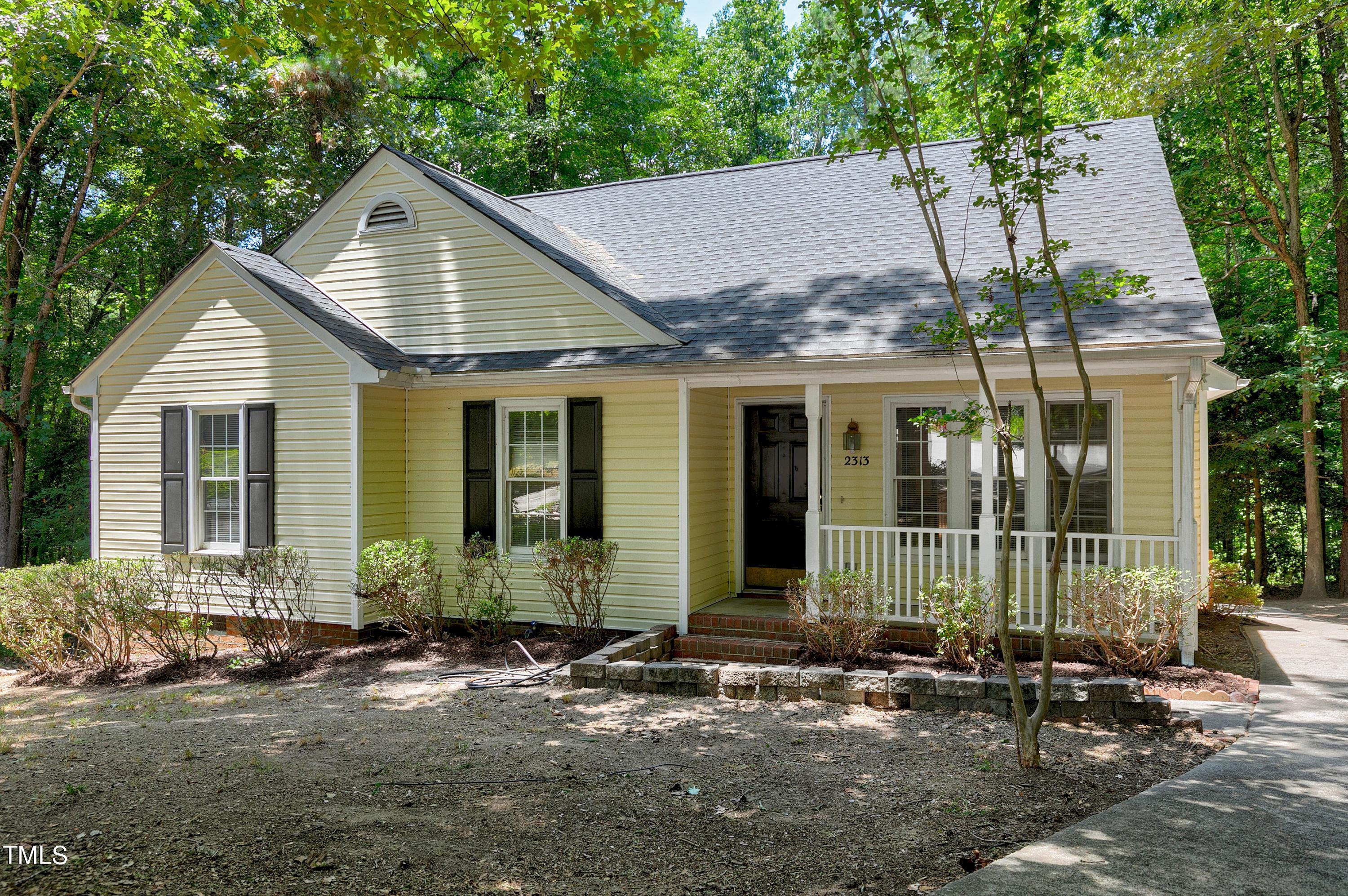 2313 Ruddy Road Raleigh, NC 27616 - Photo 2 of 32 a view of small house with yard and sitting area