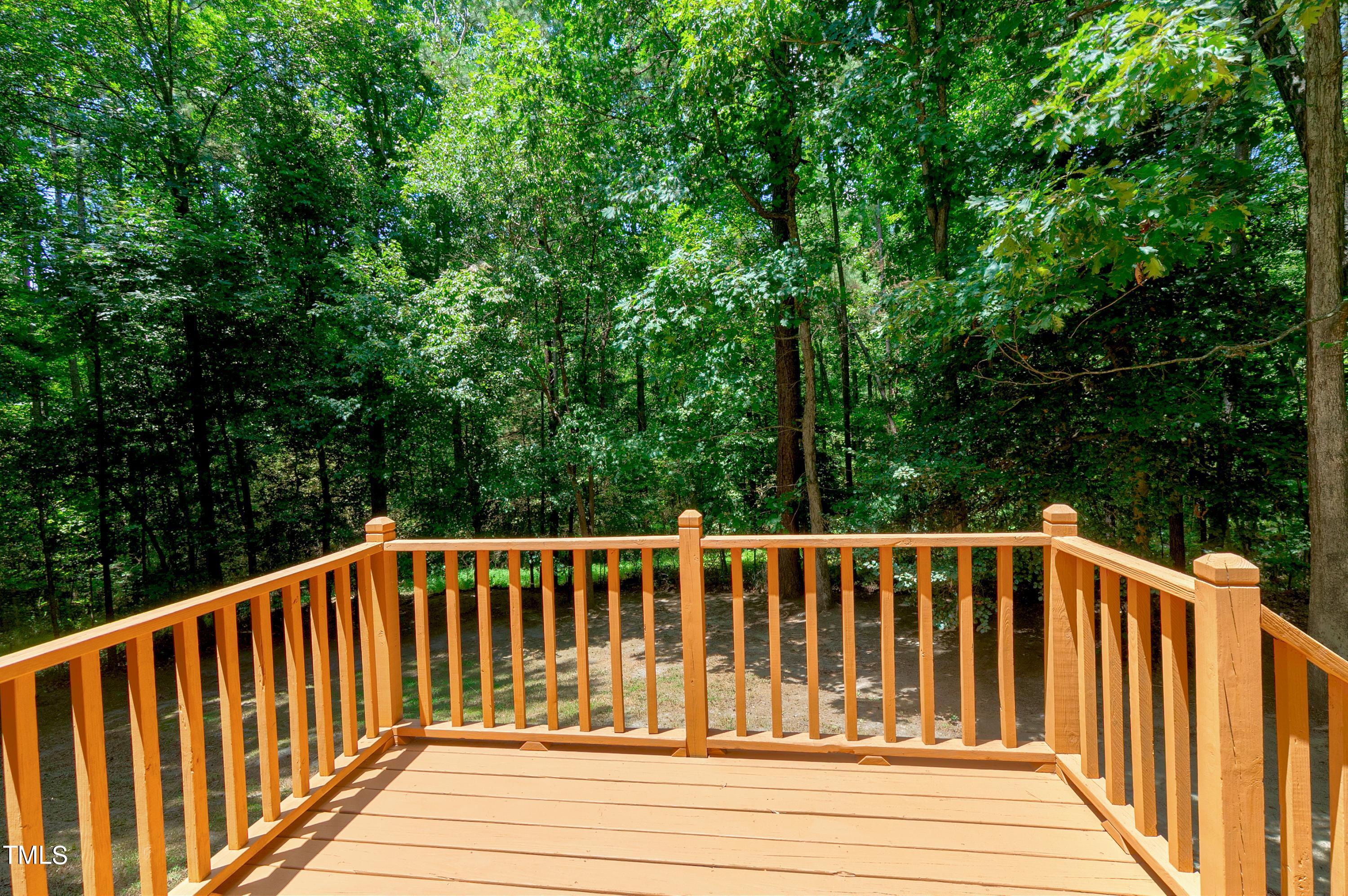 2313 Ruddy Road Raleigh, NC 27616 - Photo 7 of 32 a balcony with wooden floor in outdoor space