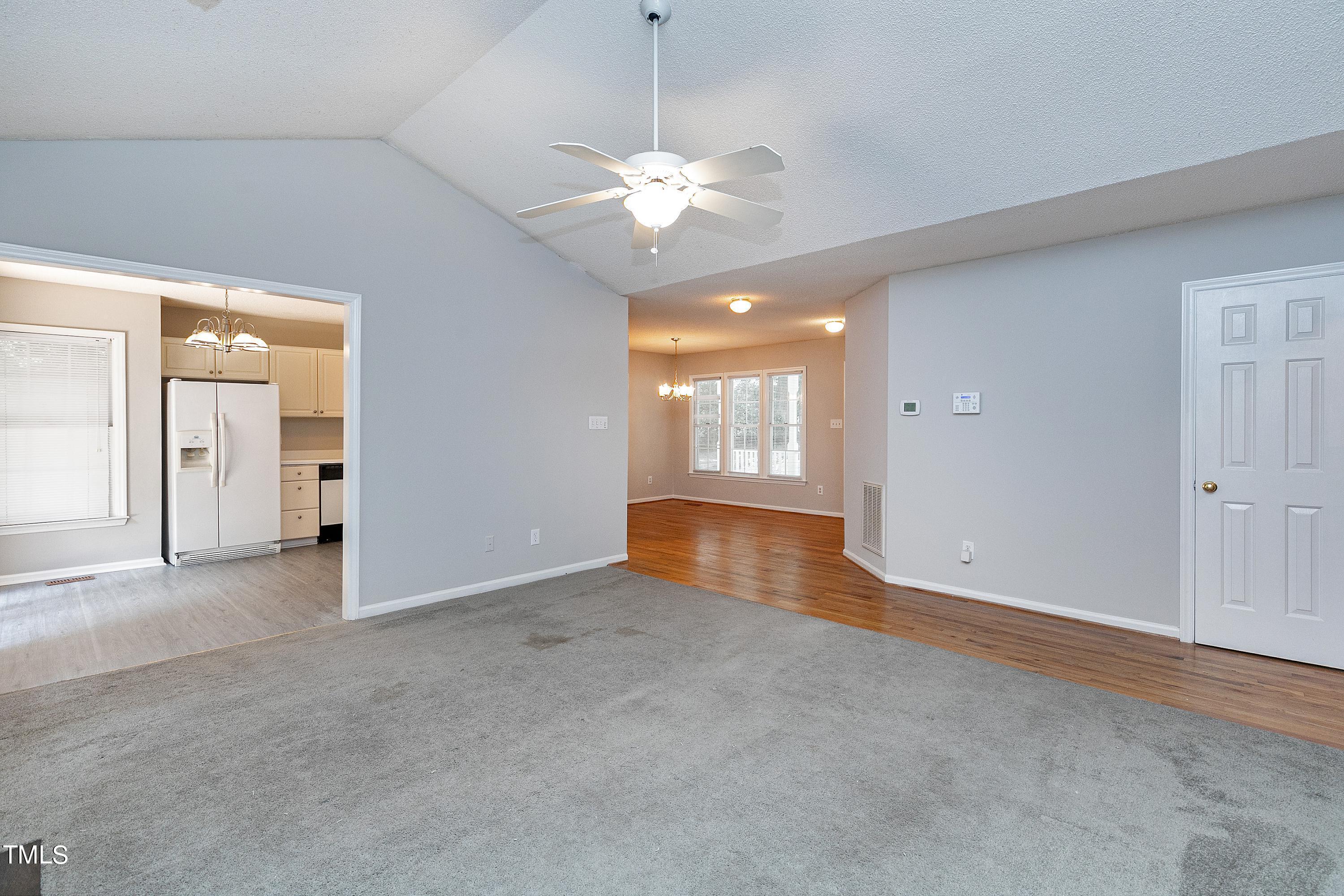 2313 Ruddy Road Raleigh, NC 27616 - Photo 10 of 32 an empty room with windows and fan