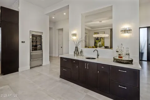 a spacious bathroom with a double vanity sink and a mirror