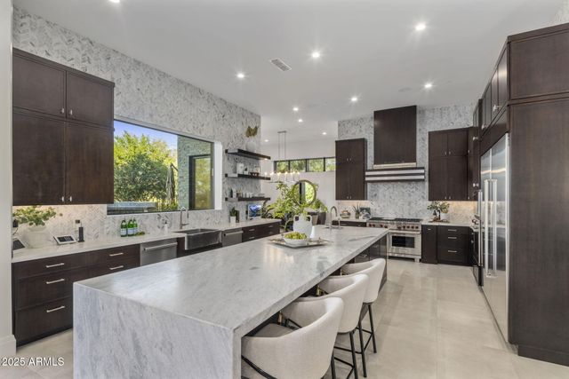 a bedroom with a bed and a potted plant