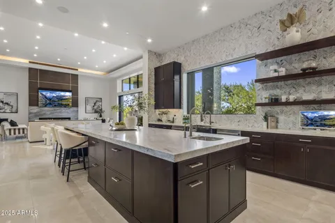 a kitchen with a sink and cabinets