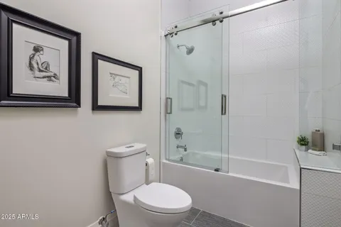 a bathroom with a sink vanity and mirror
