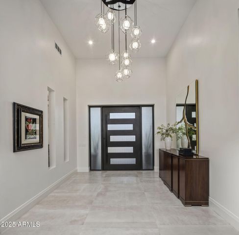 a spacious bathroom with a double vanity sink and a mirror