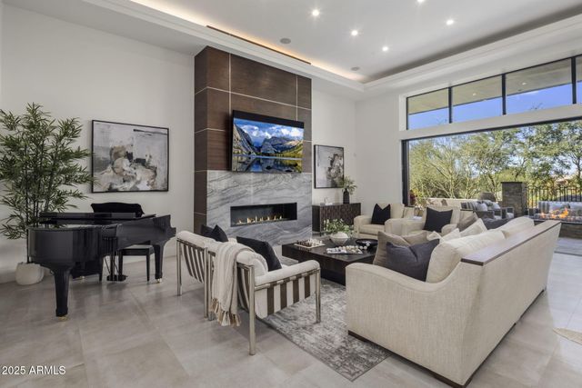 a large kitchen with stainless steel appliances kitchen island granite countertop a sink and cabinets
