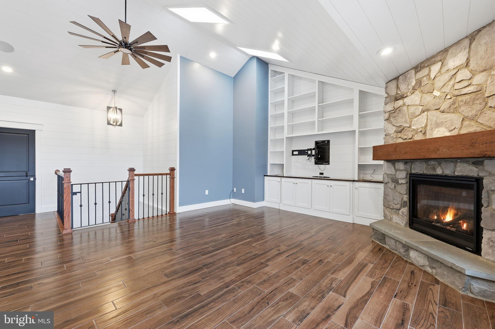 176 Fenstermaker Road Kutztown, PA 19530 - Photo 40 of 149 Spacious living area with elegant stone fireplace.