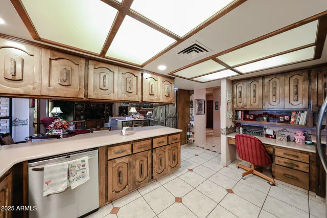 a kitchen with stainless steel appliances kitchen island granite countertop a table and chairs in it