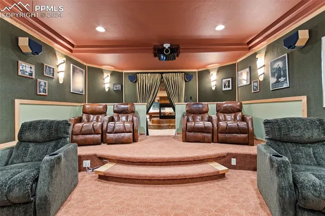 a bedroom with furniture and large windows