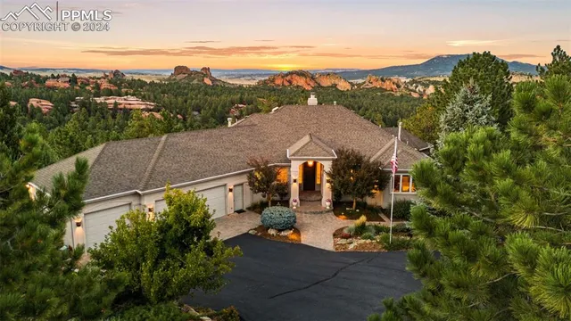 a living room with furniture and a dining table