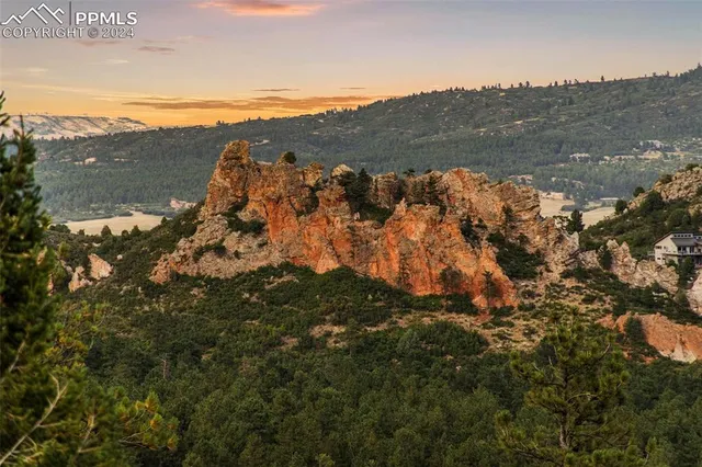 a view of mountain view with mountains in the background