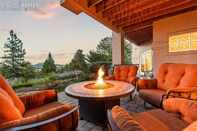 a aerial view of a house with a yard and fountain