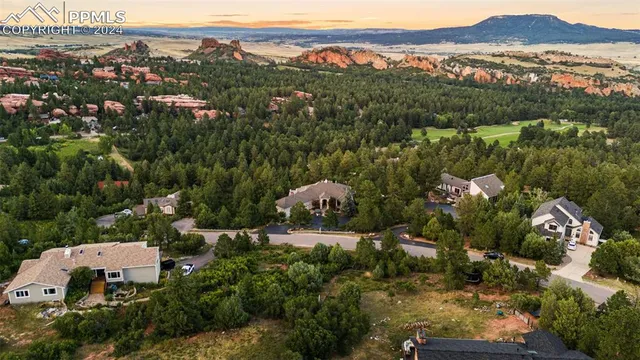 a view of a room with window and white cabinets
