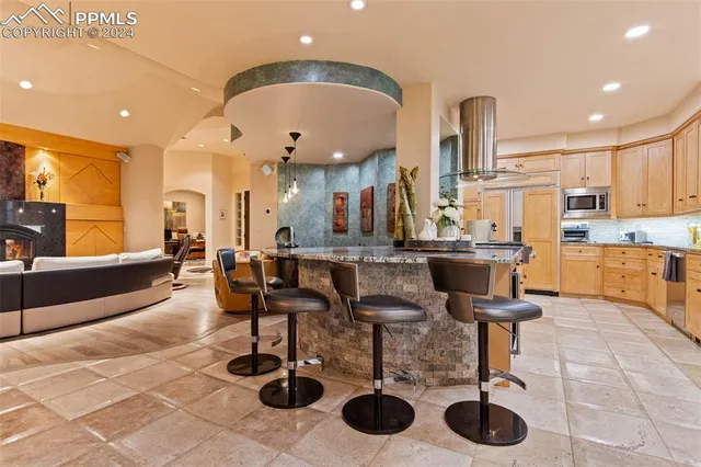 a room with lots of chairs and mirrors