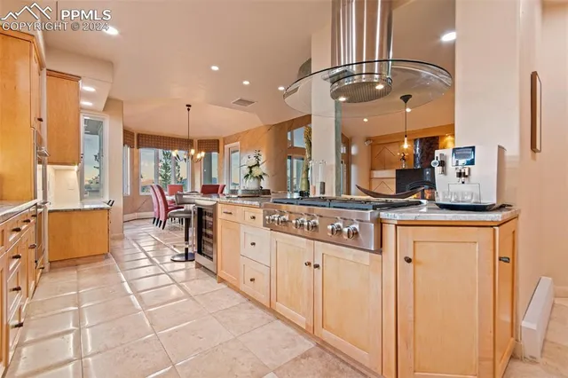 a bathroom with a sink a large mirror and a shower