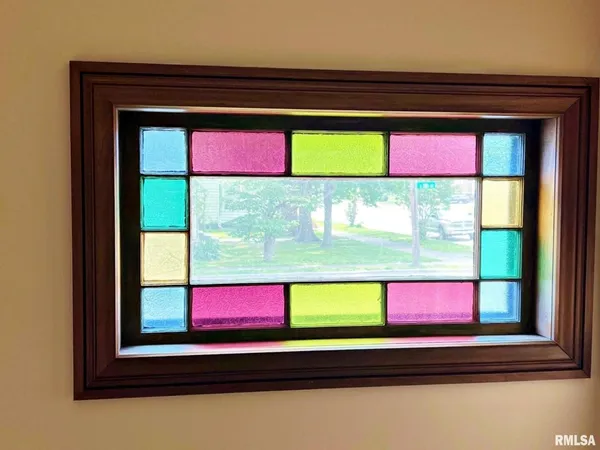 a room that has a bed and a large window