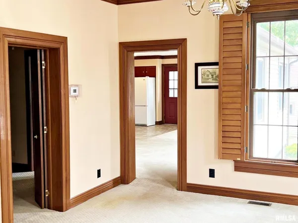 a view of a bathroom with a door and a window