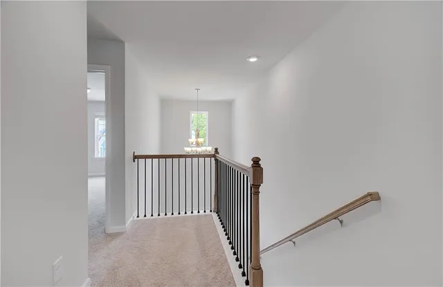 a view of a hallway with windows