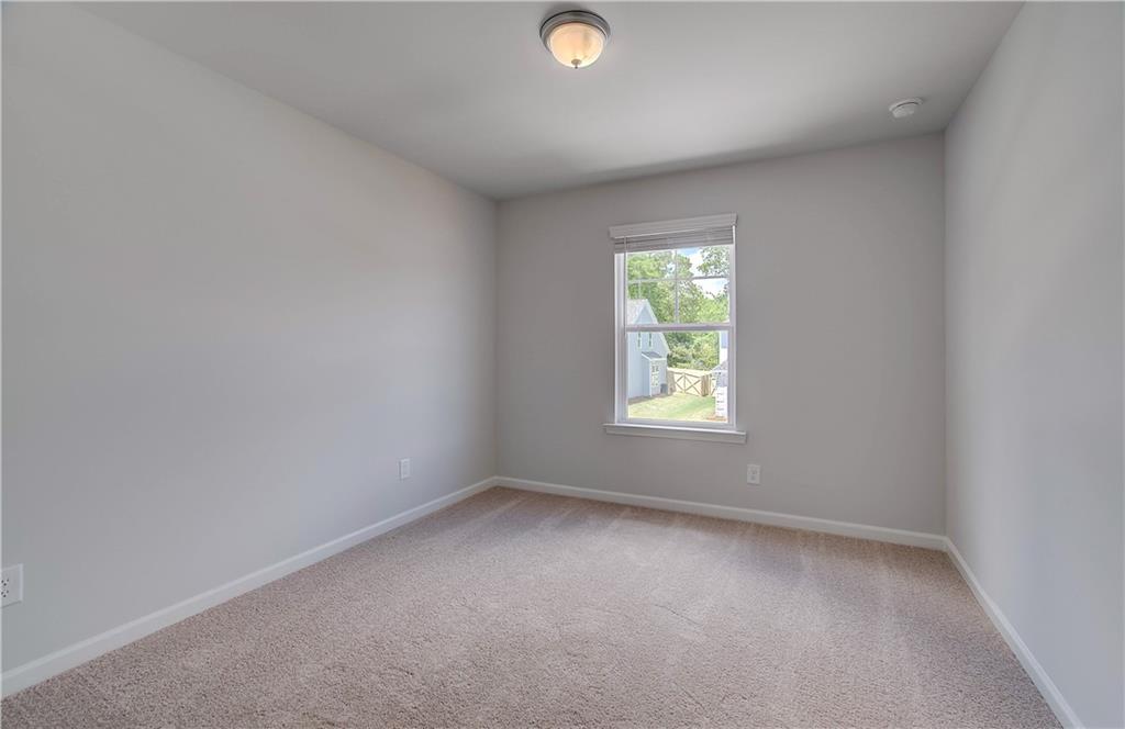 107 Alpine Road Fairburn, GA 30213 - Photo 14 of 22 an empty room with a window