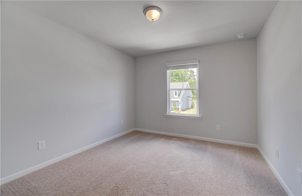 107 Alpine Road Fairburn, GA 30213 - Photo 16 of 22 an empty room with a window