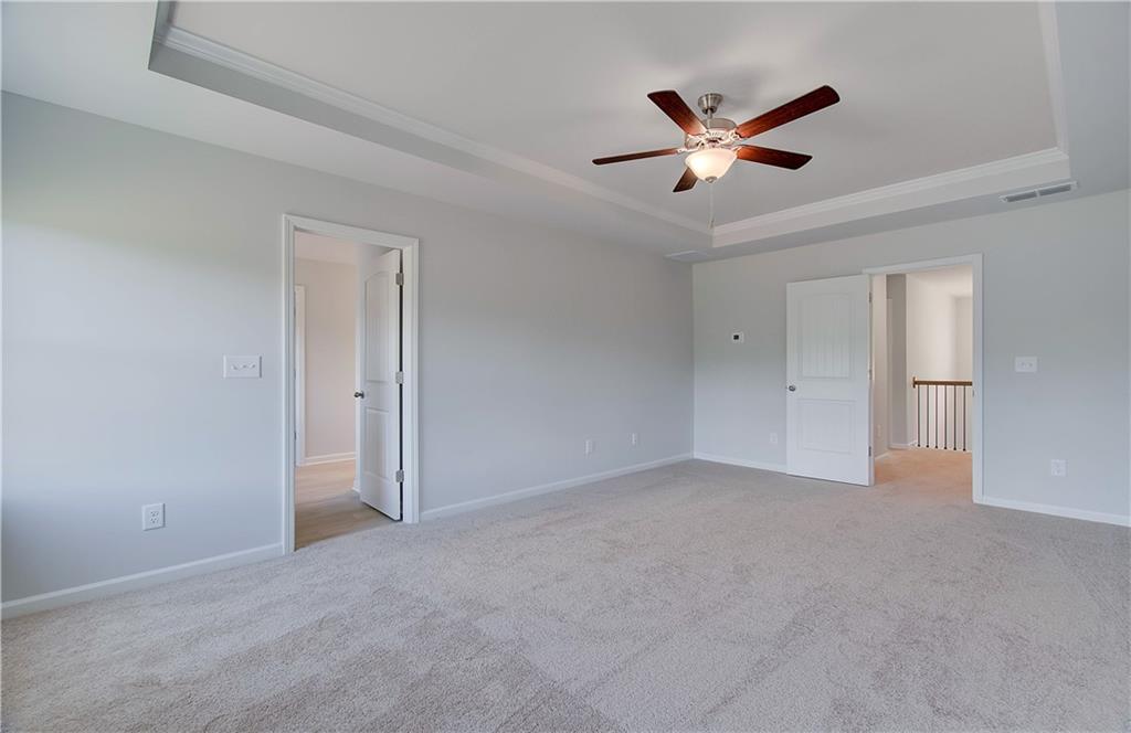 107 Alpine Road Fairburn, GA 30213 - Photo 18 of 22 a view of an empty room with a ceiling fan