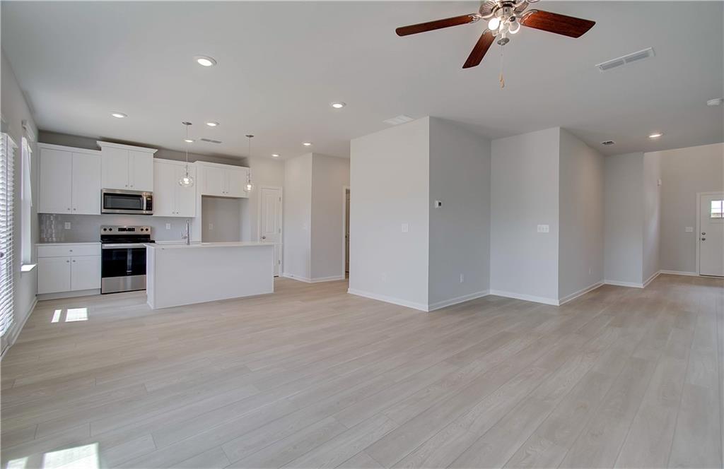 107 Alpine Road Fairburn, GA 30213 - Photo 6 of 22 a view of kitchen with stainless steel appliances refrigerator and microwave