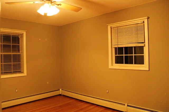 a view of empty room with windows