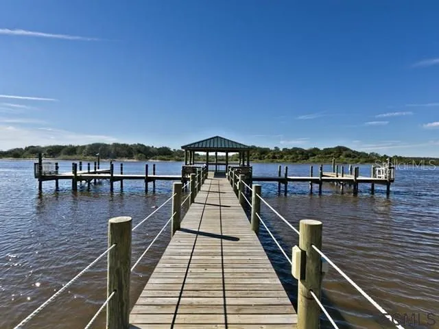 a view of wooden balcony with seating