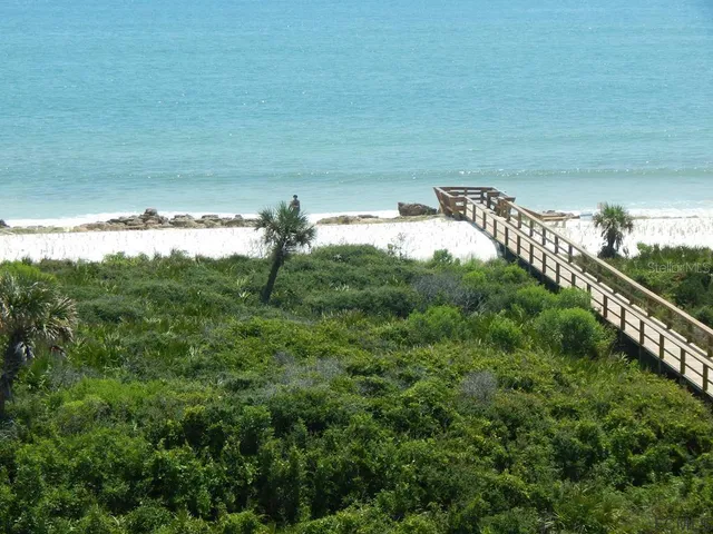 a view of a river and garden in the background