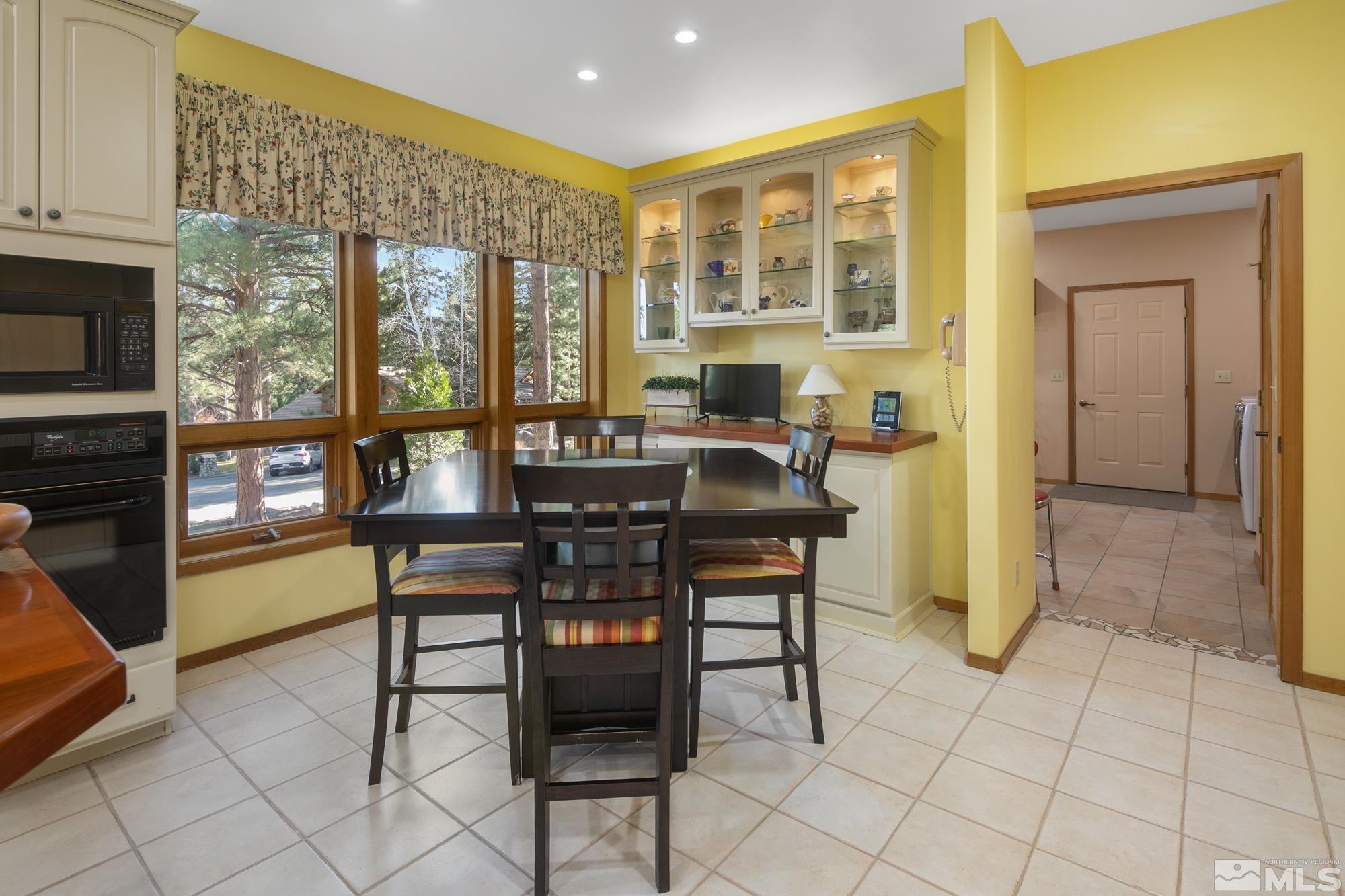 35 Austrian Pine Circle Reno, NV 89511 - Photo 11 of 39 a dining room with furniture and a floor to ceiling window
