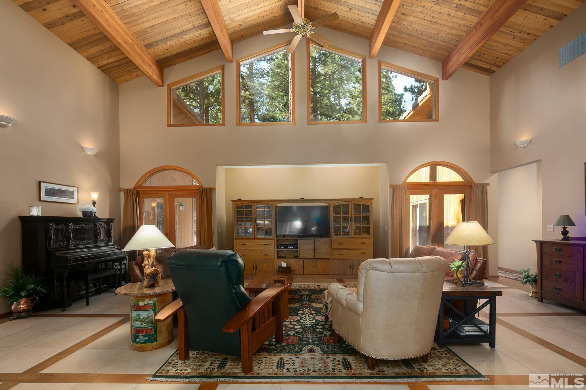 35 Austrian Pine Circle Reno, NV 89511 - Photo 13 of 39 a living room with furniture a fireplace and a table