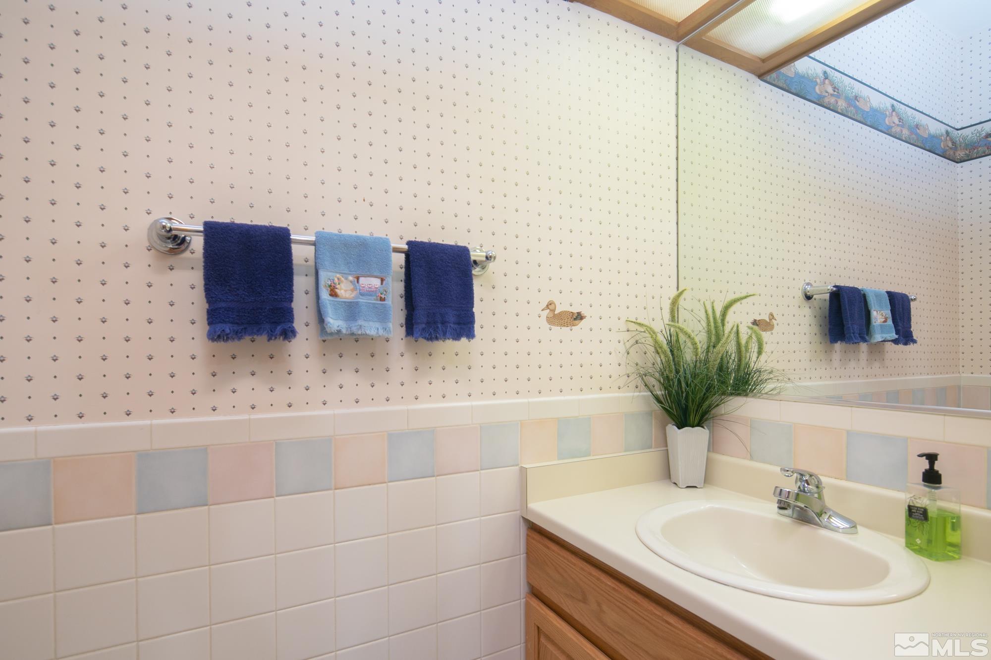 35 Austrian Pine Circle Reno, NV 89511 - Photo 34 of 39 a bathroom with a sink and a mirror