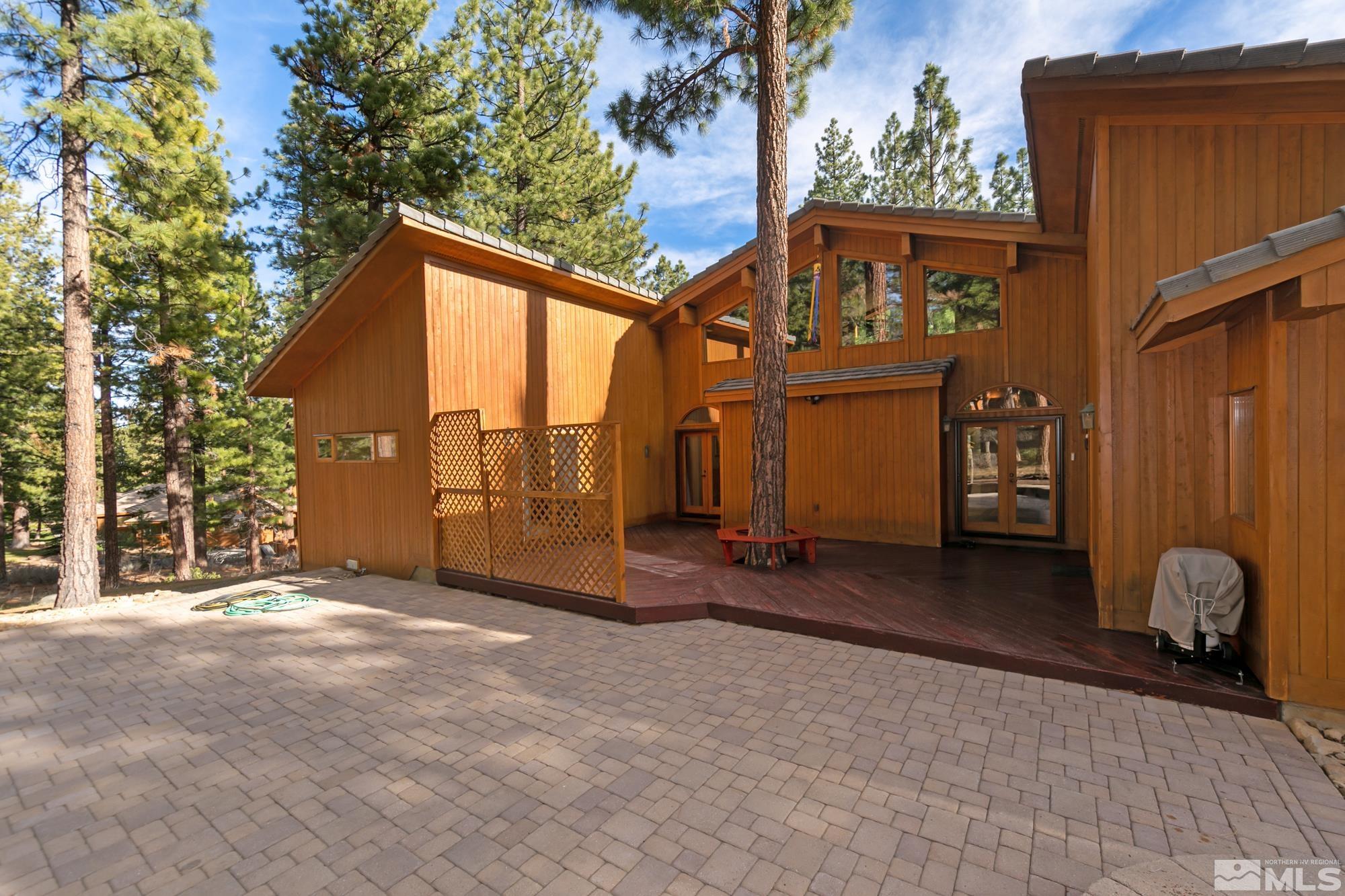 35 Austrian Pine Circle Reno, NV 89511 - Photo 35 of 39 a view of a house with wooden fence and a large tree