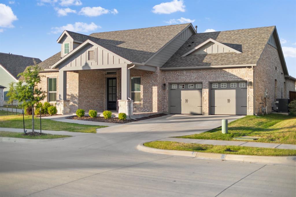8808 Royal Star Road Rowlett, TX 75089 - Photo 8 of 40 a view of a white house with a yard in front of it