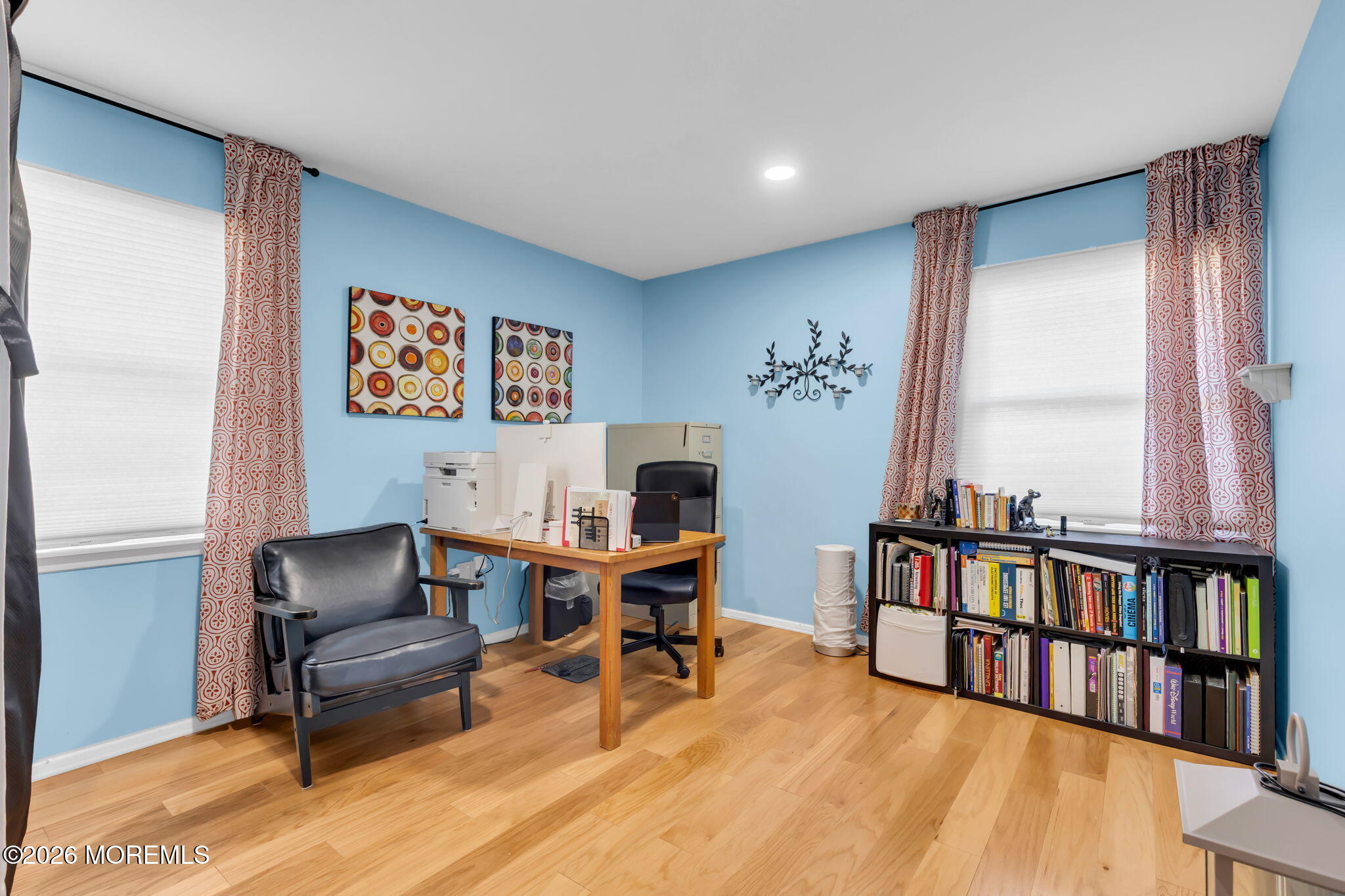 101 Andover Lane Matawan, NJ 07747 - Photo 30 of 51 a living room with furniture and a book shelf