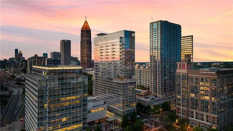 a city skyline with tall buildings
