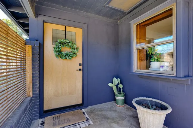 a view of small house with potted plant