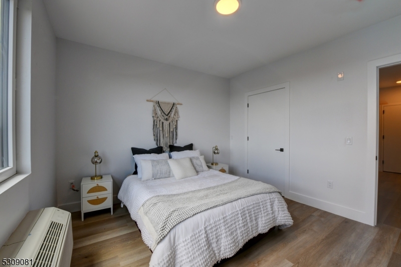 39 Madison Street Newark, NJ 07105 - Photo 11 of 33 a bedroom with a bed and a window