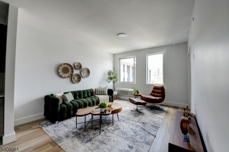 39 Madison Street Newark, NJ 07105 - Photo 18 of 33 a living room with furniture a rug and a window