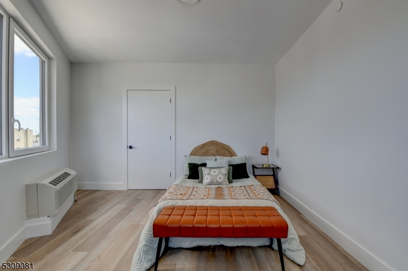 39 Madison Street Newark, NJ 07105 - Photo 22 of 33 a room with a bed and a window