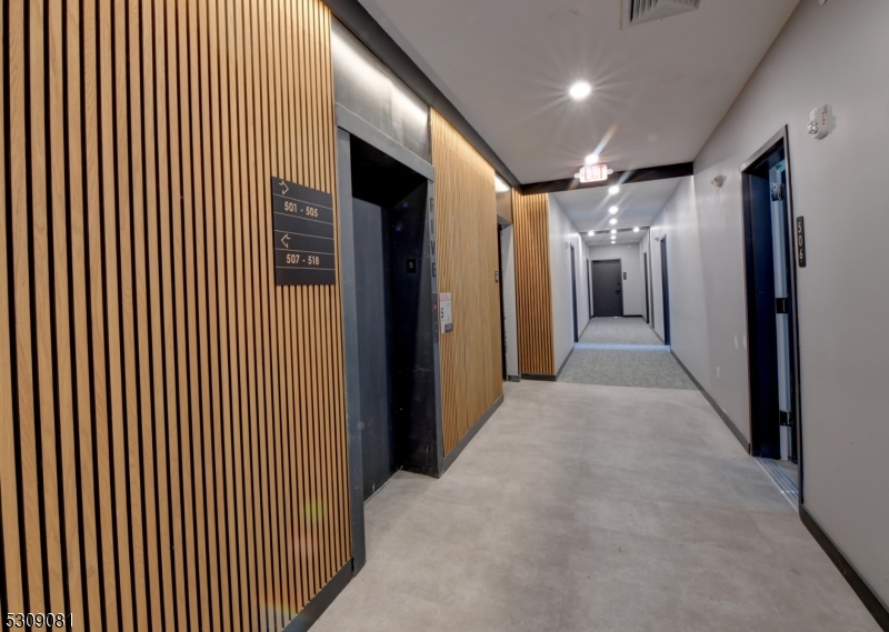 39 Madison Street Newark, NJ 07105 - Photo 23 of 33 a view of hallway with a large mirror