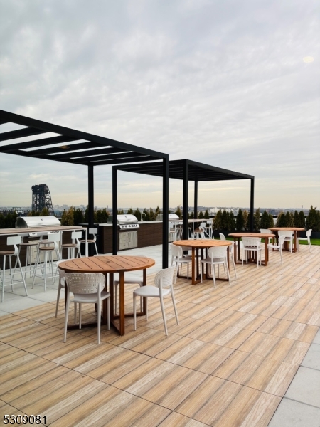 39 Madison Street Newark, NJ 07105 - Photo 30 of 33 a living room with patio furniture and a large window