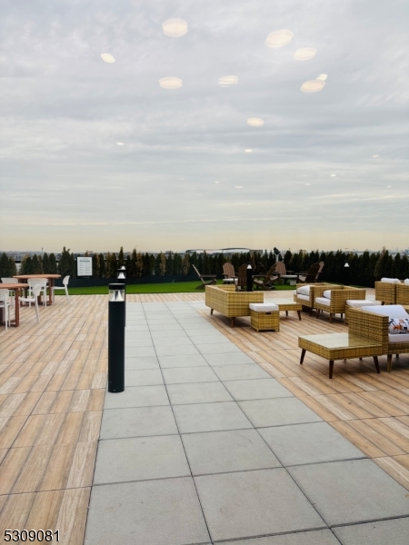 39 Madison Street Newark, NJ 07105 - Photo 32 of 33 a view of swimming pool outdoor seating and city view